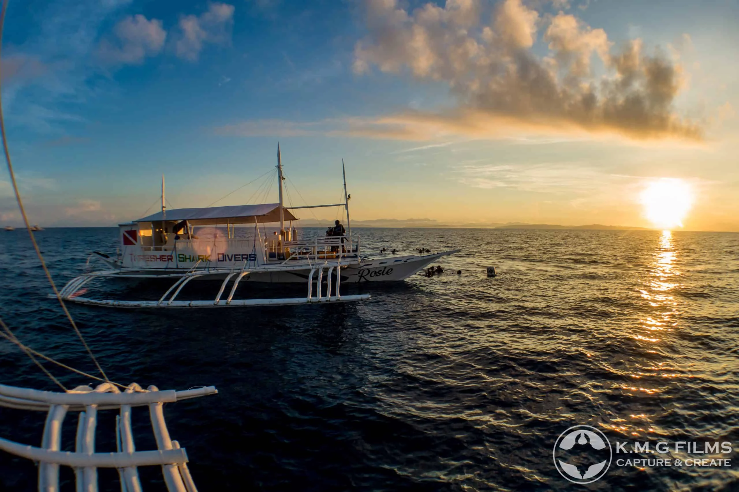 Sunrise over the water before an early morning dive at Malapascua